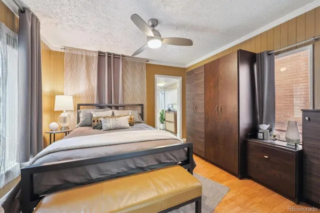 a view of a house with a small yard and wooden fence