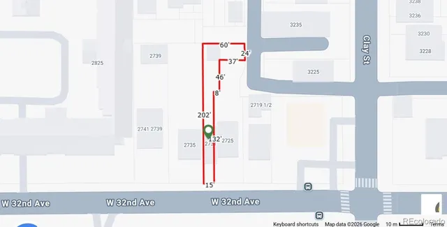 a front view of a building with large windows and a small yard