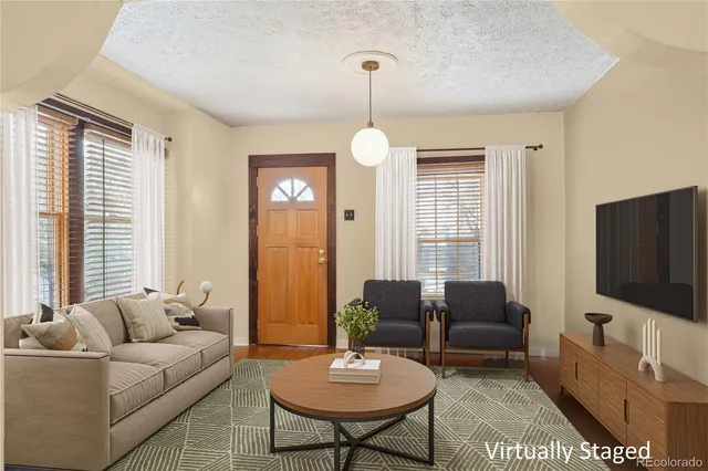 a spacious bedroom with a bed and a fireplace