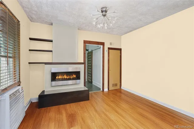 a kitchen with stainless steel appliances granite countertop a sink and a refrigerator