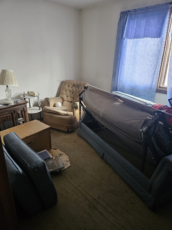 490 School Street, Unit 2 Lowell, MA 01851 - Photo 16 of 26 a living room with furniture and a window