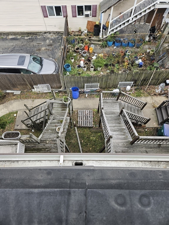 490 School Street, Unit 2 Lowell, MA 01851 - Photo 22 of 26 front view of a building with garden