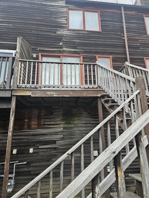 490 School Street, Unit 2 Lowell, MA 01851 - Photo 9 of 26 a view of balcony with staircase