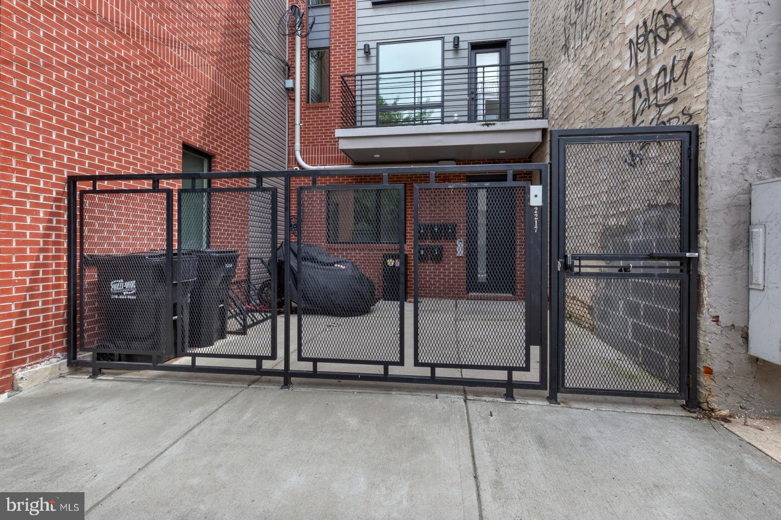 2212 North Front Street, Unit 5 Philadelphia, PA 19133 - Photo 24 of 25 a view of a house with backyard and glass door
