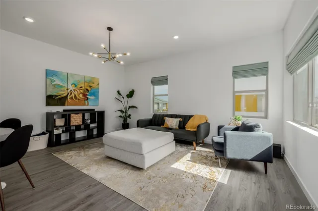 a spacious bedroom with a bed a couch and a window