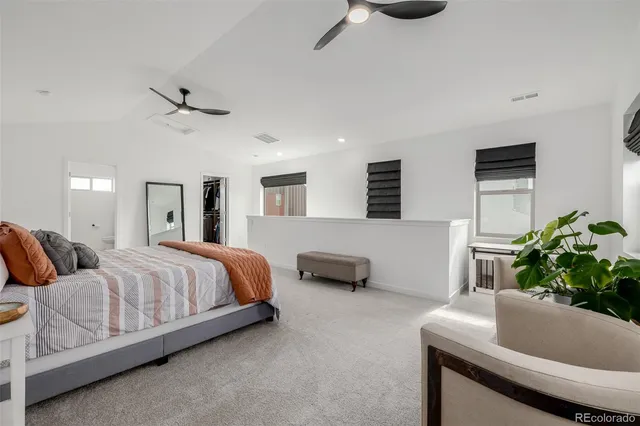 a bedroom with bed and window