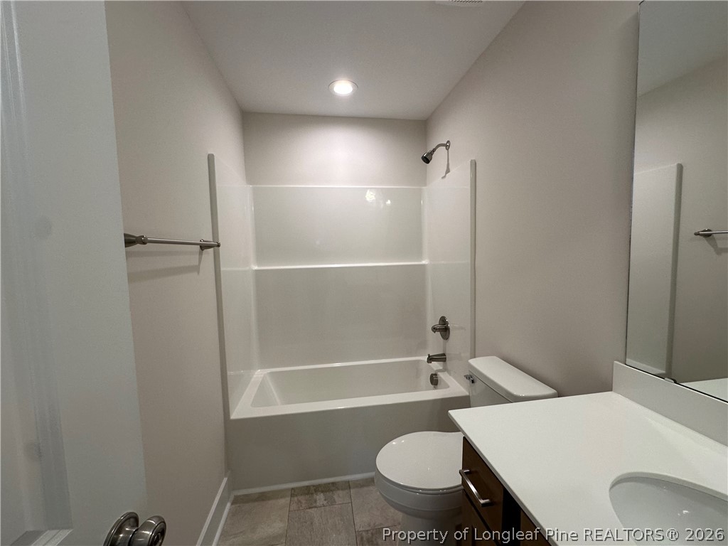 2908 Calloway Road Raeford, NC 28376 - Photo 20 of 25 a bathroom with a sink toilet vanity and shower