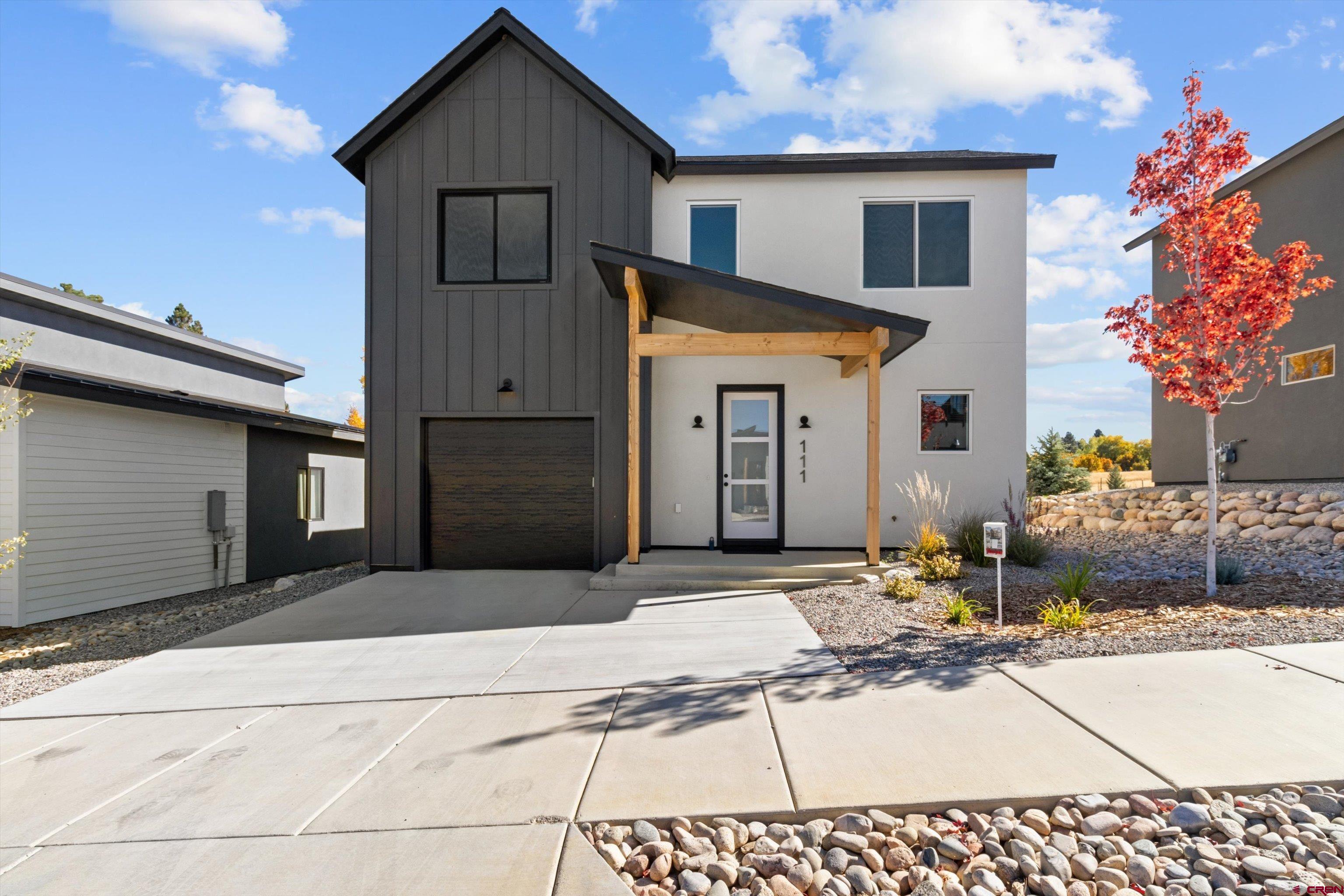 111 Elevation Drive Durango, CO 81303 - Photo 2 of 33 a front view of a house with a yard