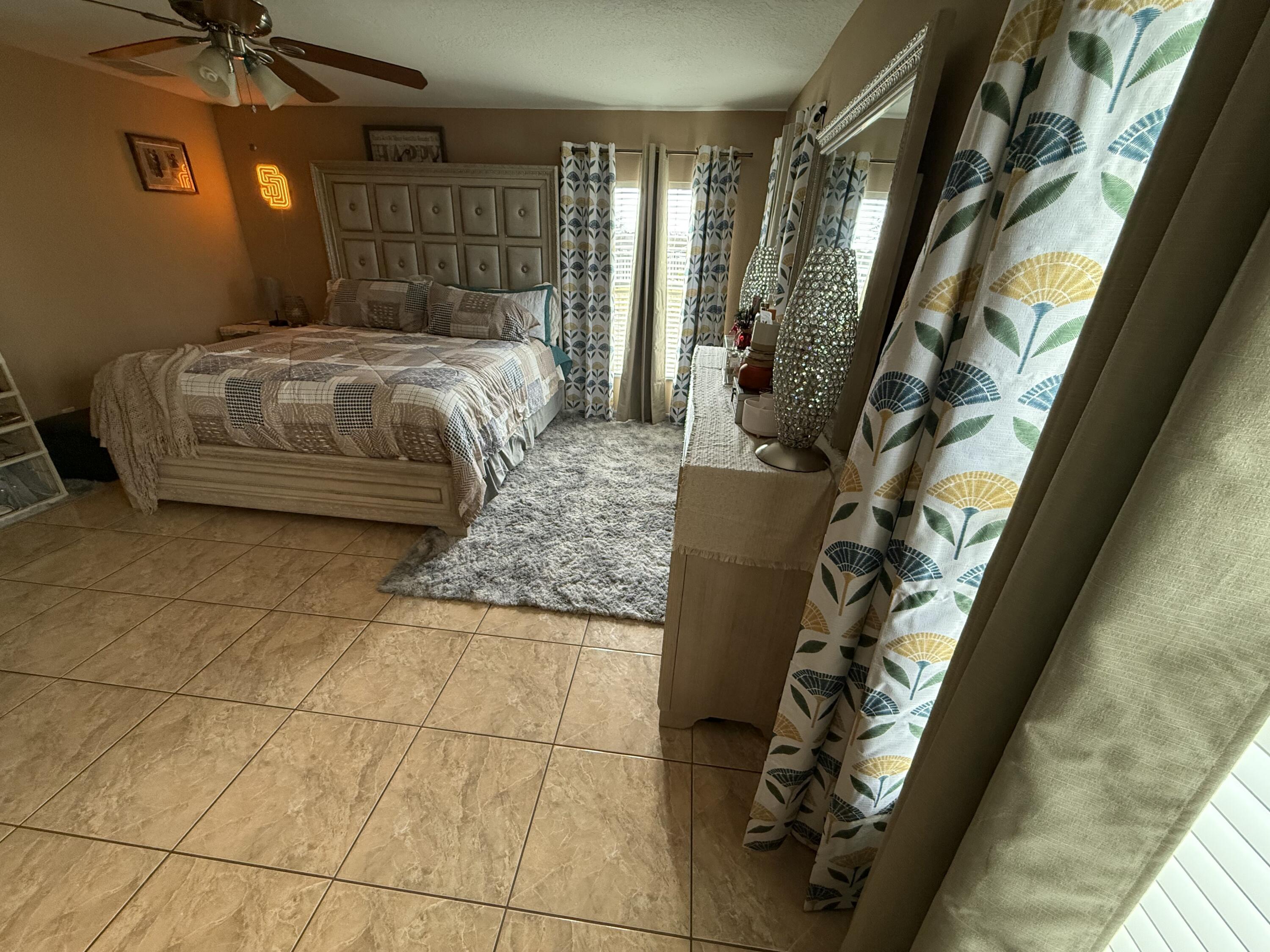 4010 Watkins Road Haines City, FL 33844 - Photo 4 of 8 a bedroom with a bed and a window