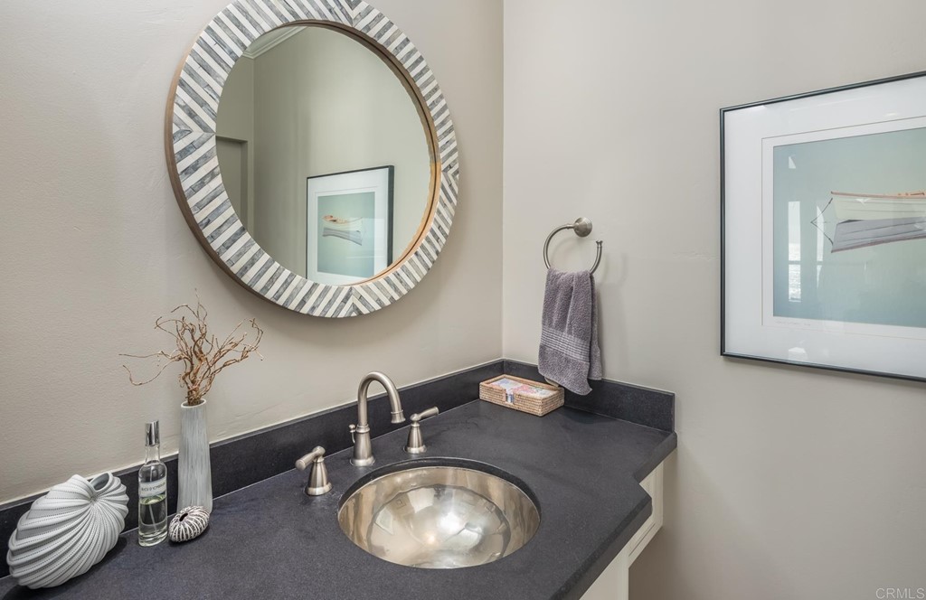 510 4th Street, Unit 3C Encinitas, CA 92024 - Photo 15 of 30 a bathroom with a sink and a mirror