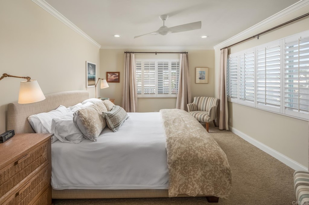 510 4th Street, Unit 3C Encinitas, CA 92024 - Photo 16 of 30 a bedroom with a bed and wooden floor