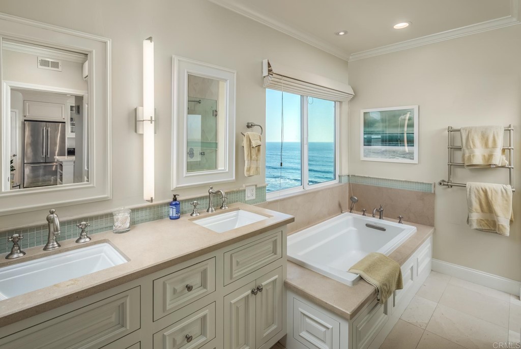 510 4th Street, Unit 3C Encinitas, CA 92024 - Photo 17 of 30 a bathroom with a sink and a mirror