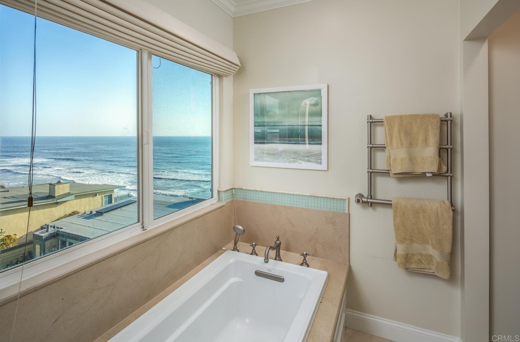 510 4th Street, Unit 3C Encinitas, CA 92024 - Photo 18 of 30 a bathroom with a bathtub and next to a window
