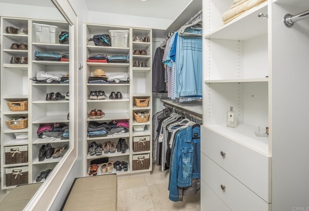 510 4th Street, Unit 3C Encinitas, CA 92024 - Photo 19 of 30 a view of walk in closet with clothes and shoes