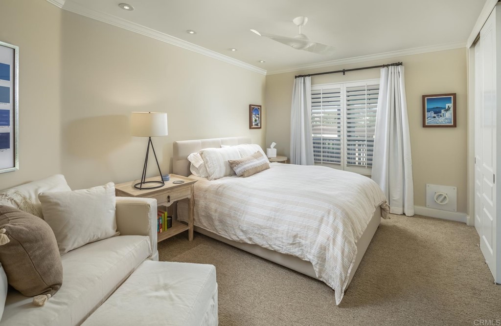 510 4th Street, Unit 3C Encinitas, CA 92024 - Photo 20 of 30 a bedroom with a bed and a couch