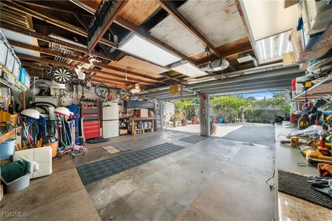 a view of a garage with wooden benches
