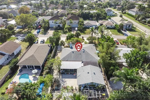an aerial view of multiple houses with yard