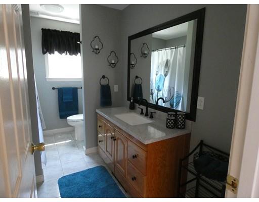 16 Prospect Street Rutland, MA 01543 - Photo 19 of 42 a bathroom with a sink a toilet and mirror