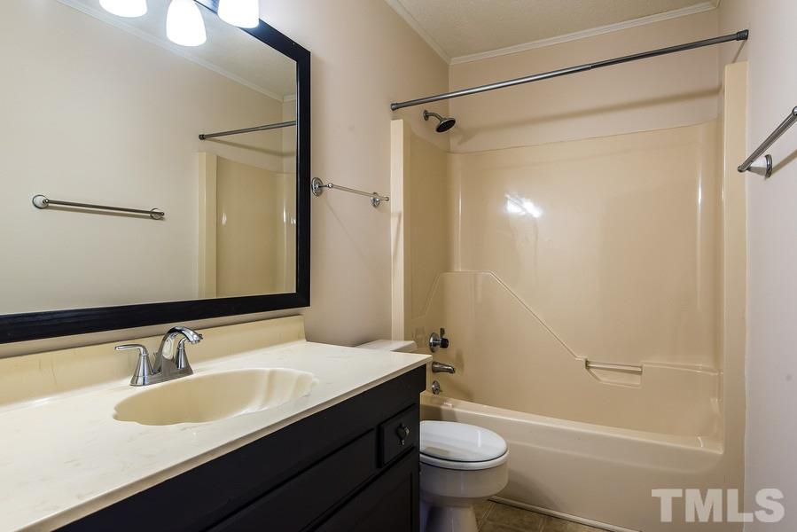 3308 Wade Avenue Raleigh, NC 27607 - Photo 22 of 24 a bathroom with a granite countertop sink toilet and shower