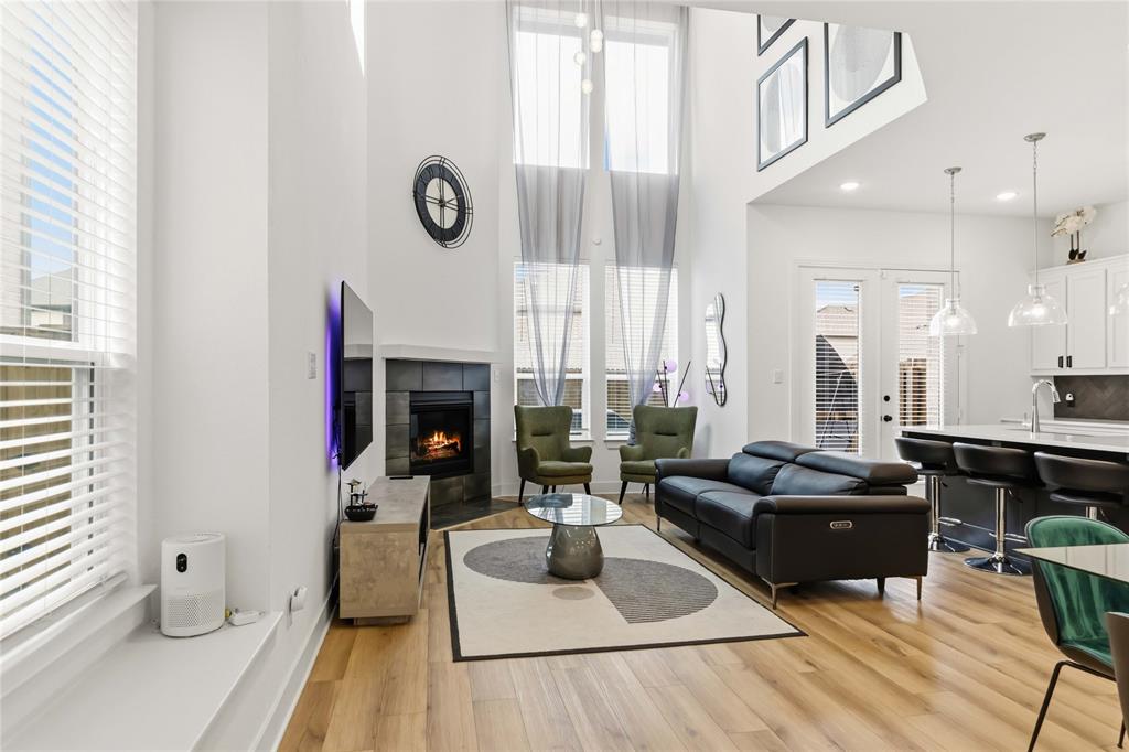 1128 Queensdown Way Forney, TX 75126 - Photo 1 of 25 a living room with furniture and a fireplace