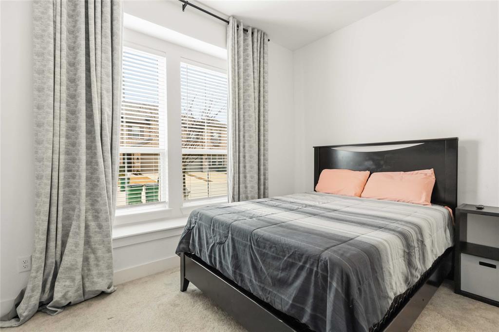 1128 Queensdown Way Forney, TX 75126 - Photo 12 of 25 a bedroom with a bed and a window