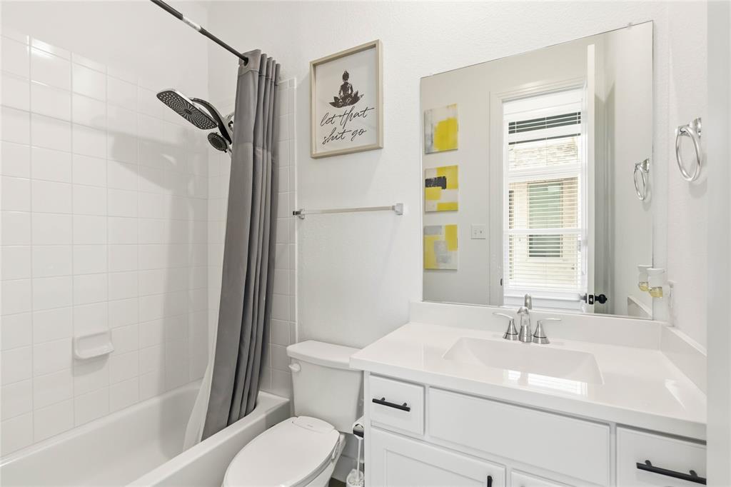 1128 Queensdown Way Forney, TX 75126 - Photo 13 of 25 a bathroom with a sink toilet and shower