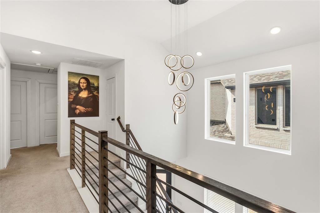 1128 Queensdown Way Forney, TX 75126 - Photo 17 of 25 a view of a hallway with wooden floor and windows
