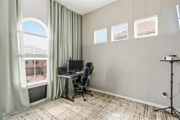 a workspace with furniture and a window