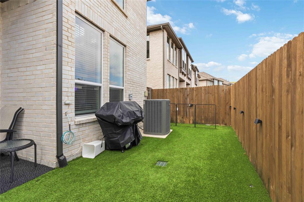1128 Queensdown Way Forney, TX 75126 - Photo 2 of 25 a view of a porch with chairs and a backyard