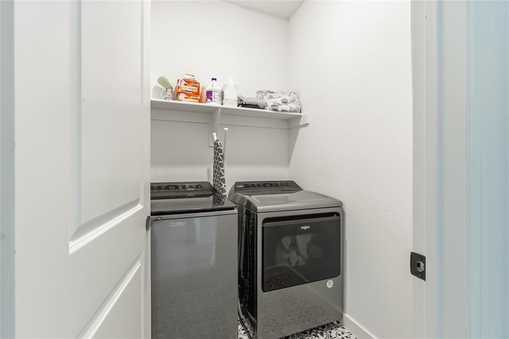 1128 Queensdown Way Forney, TX 75126 - Photo 22 of 25 a utility room with dryer and washer