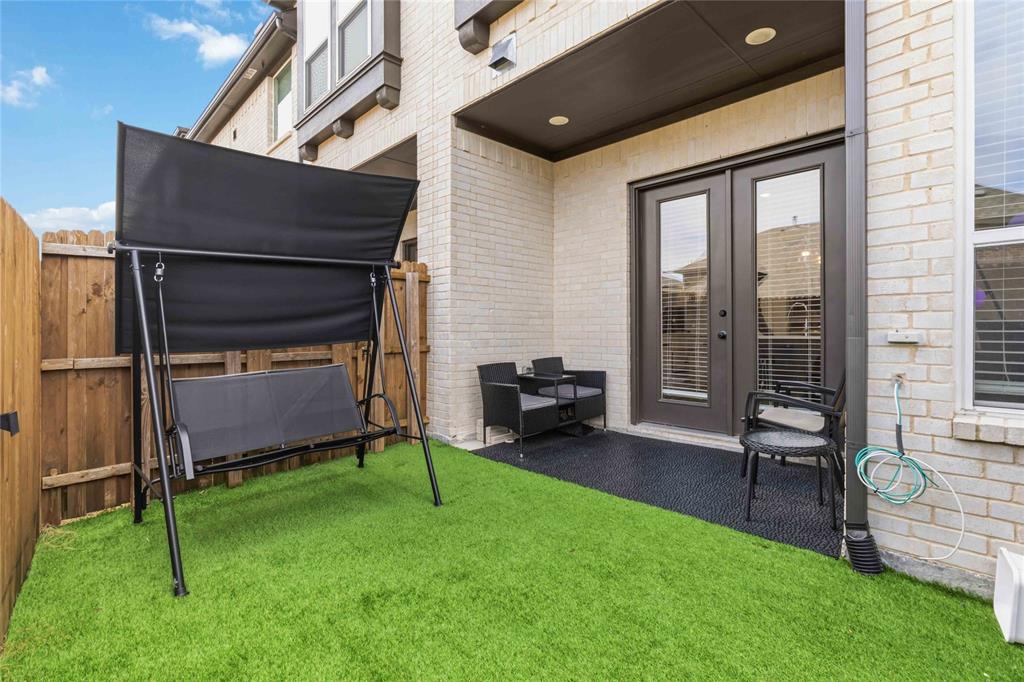 1128 Queensdown Way Forney, TX 75126 - Photo 25 of 25 a view of yard with porch and outdoor seating