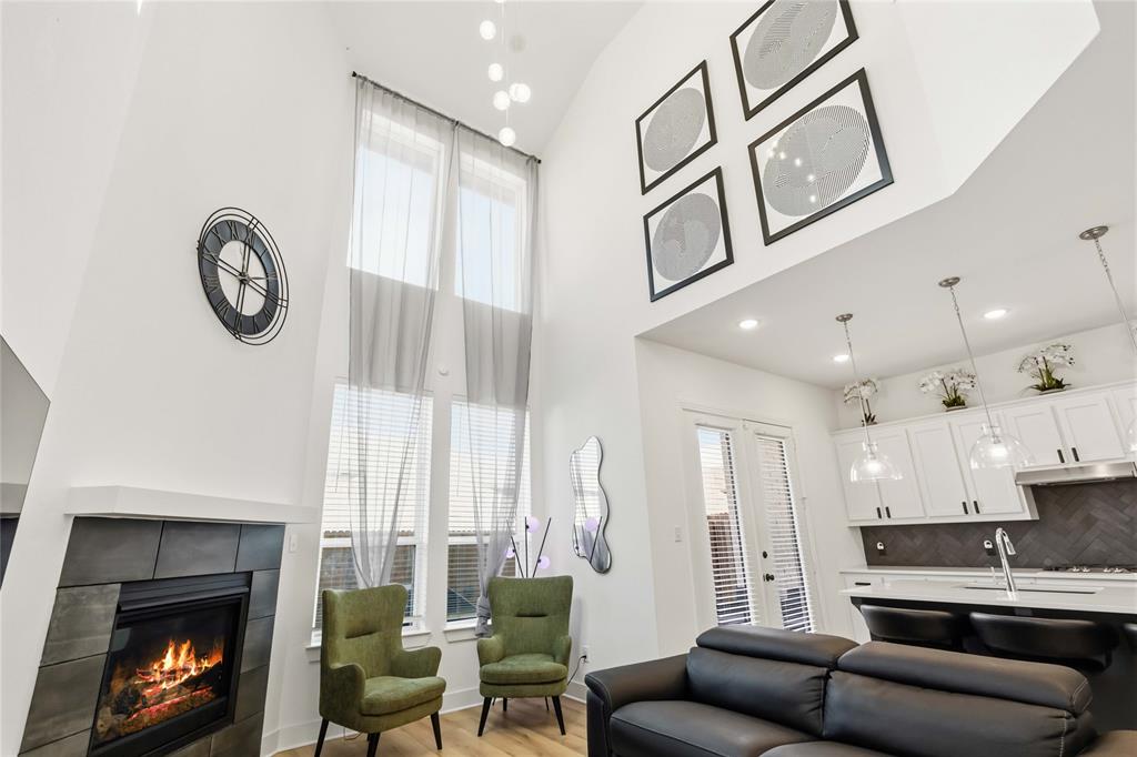 1128 Queensdown Way Forney, TX 75126 - Photo 9 of 25 a living room with furniture and a fireplace