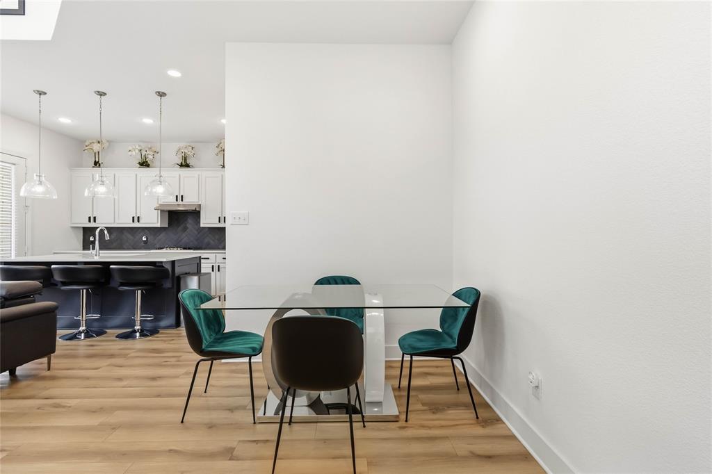 1128 Queensdown Way Forney, TX 75126 - Photo 10 of 25 a view of kitchen with cabinets and wooden floor