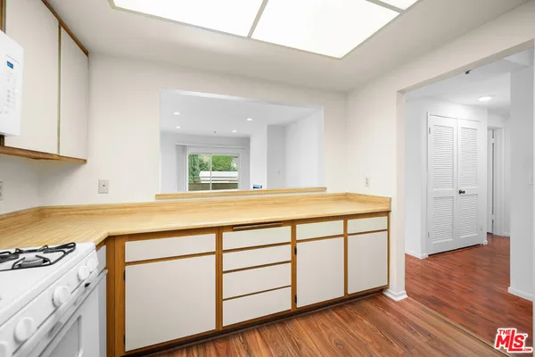 a spacious bathroom with a sink and a mirror