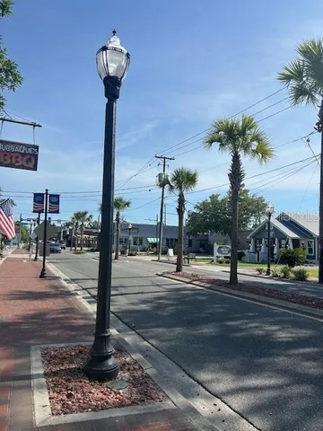a lamp on the side of a street