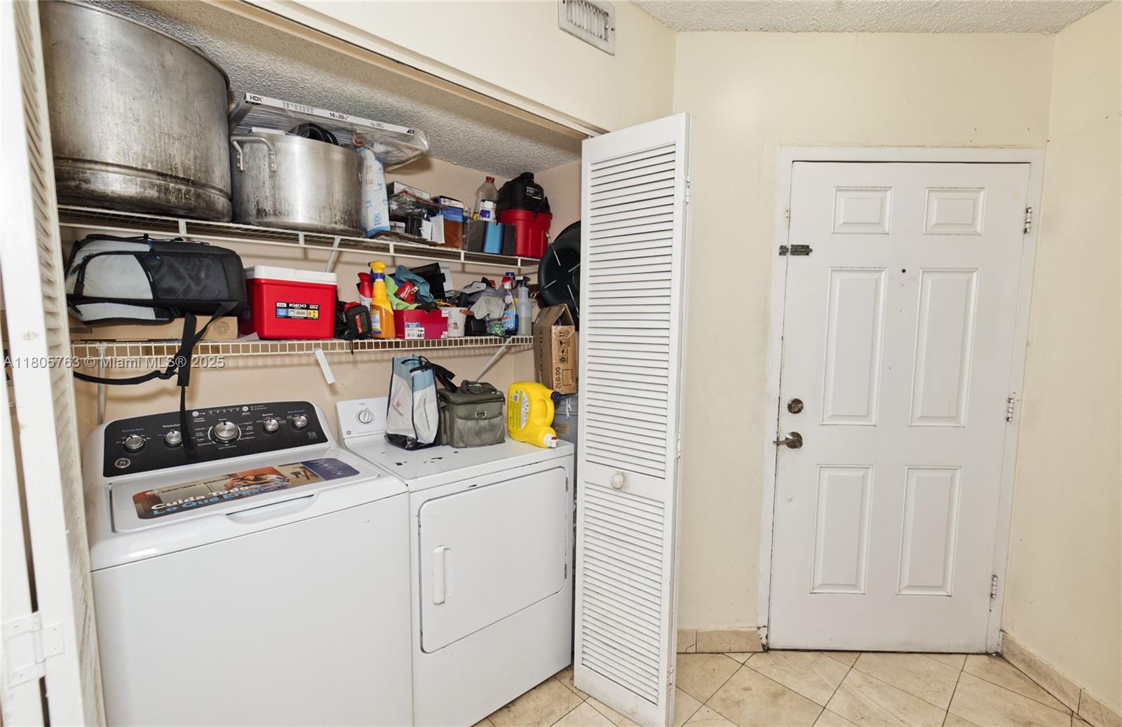 1750 West 46th Street, Unit 503 Hialeah, FL 33012 - Photo 11 of 24 a utility room with dryer and washer