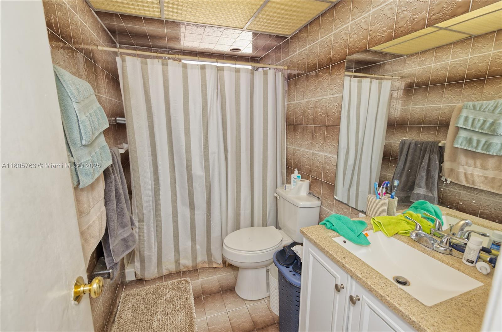 1750 West 46th Street, Unit 503 Hialeah, FL 33012 - Photo 17 of 24 a bathroom with a sink toilet and shower