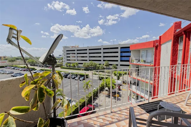 a view of a chairs and table in patio
