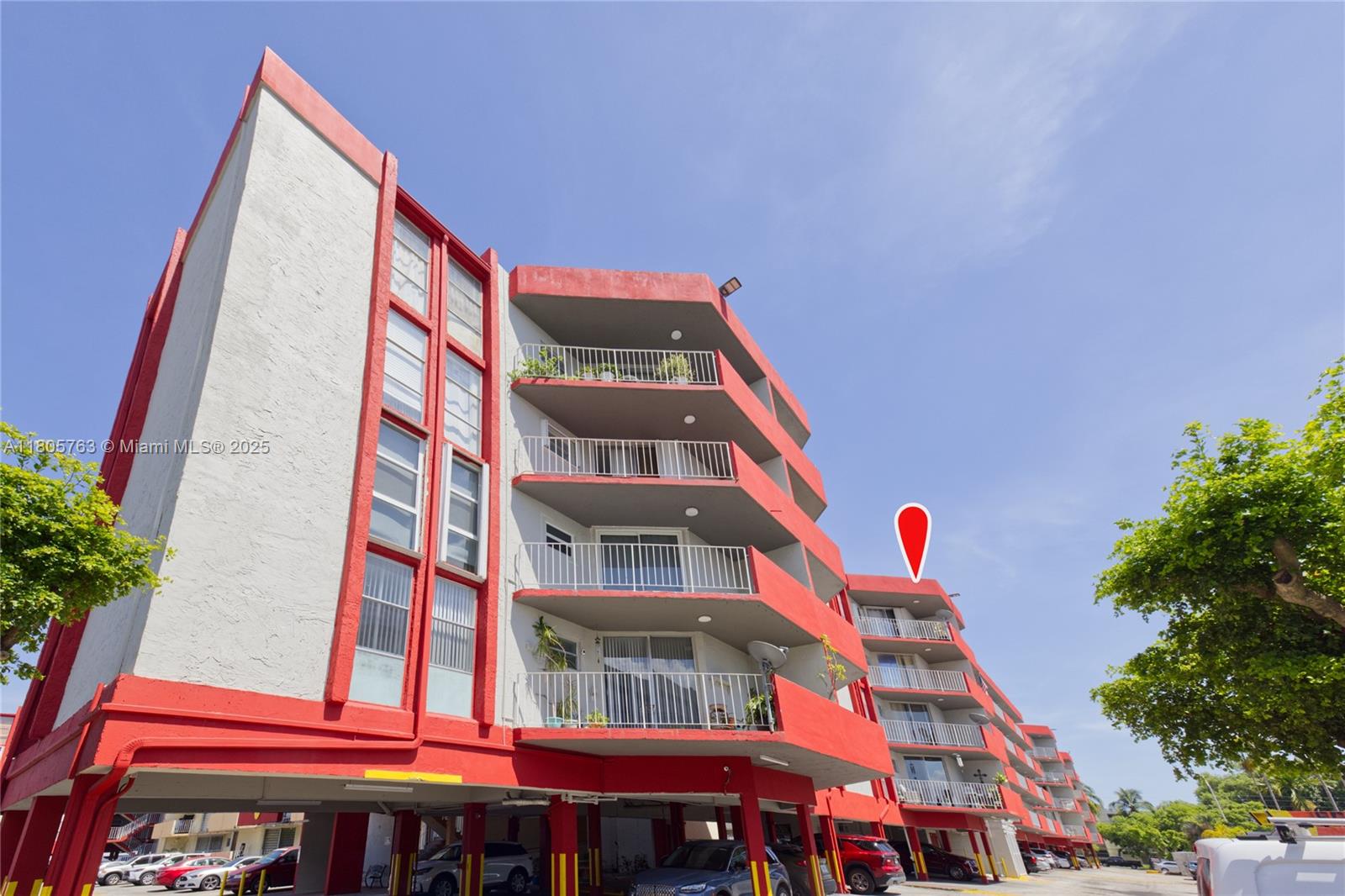 1750 West 46th Street, Unit 503 Hialeah, FL 33012 - Photo 24 of 24 a front view of a multi story residential apartment building with yard