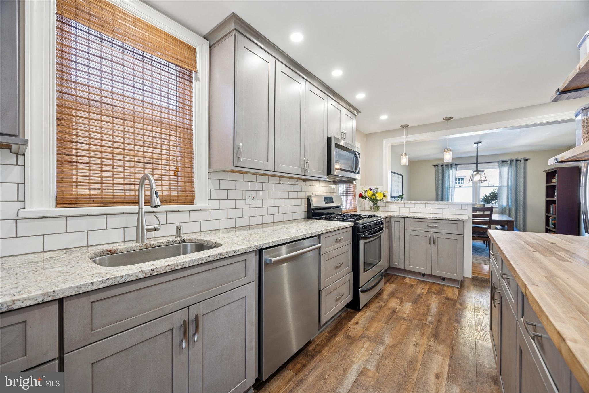 22 Mansfield Road Lansdowne, PA 19050 - Photo 11 of 25 a kitchen with a sink stove and cabinets
