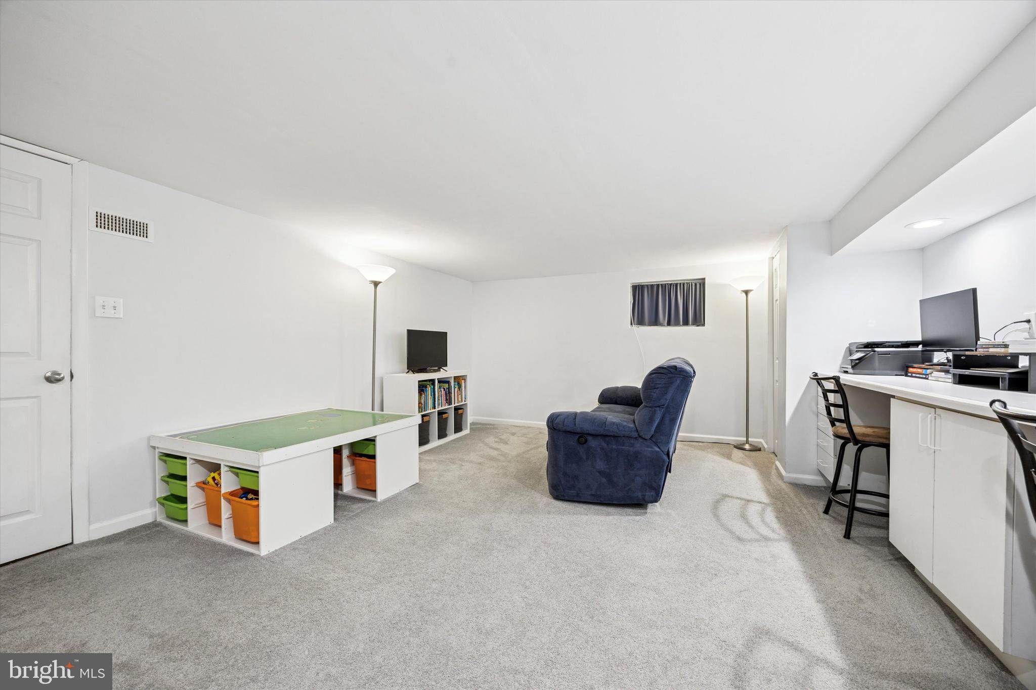 22 Mansfield Road Lansdowne, PA 19050 - Photo 19 of 25 a living room with furniture a flat screen tv and a window