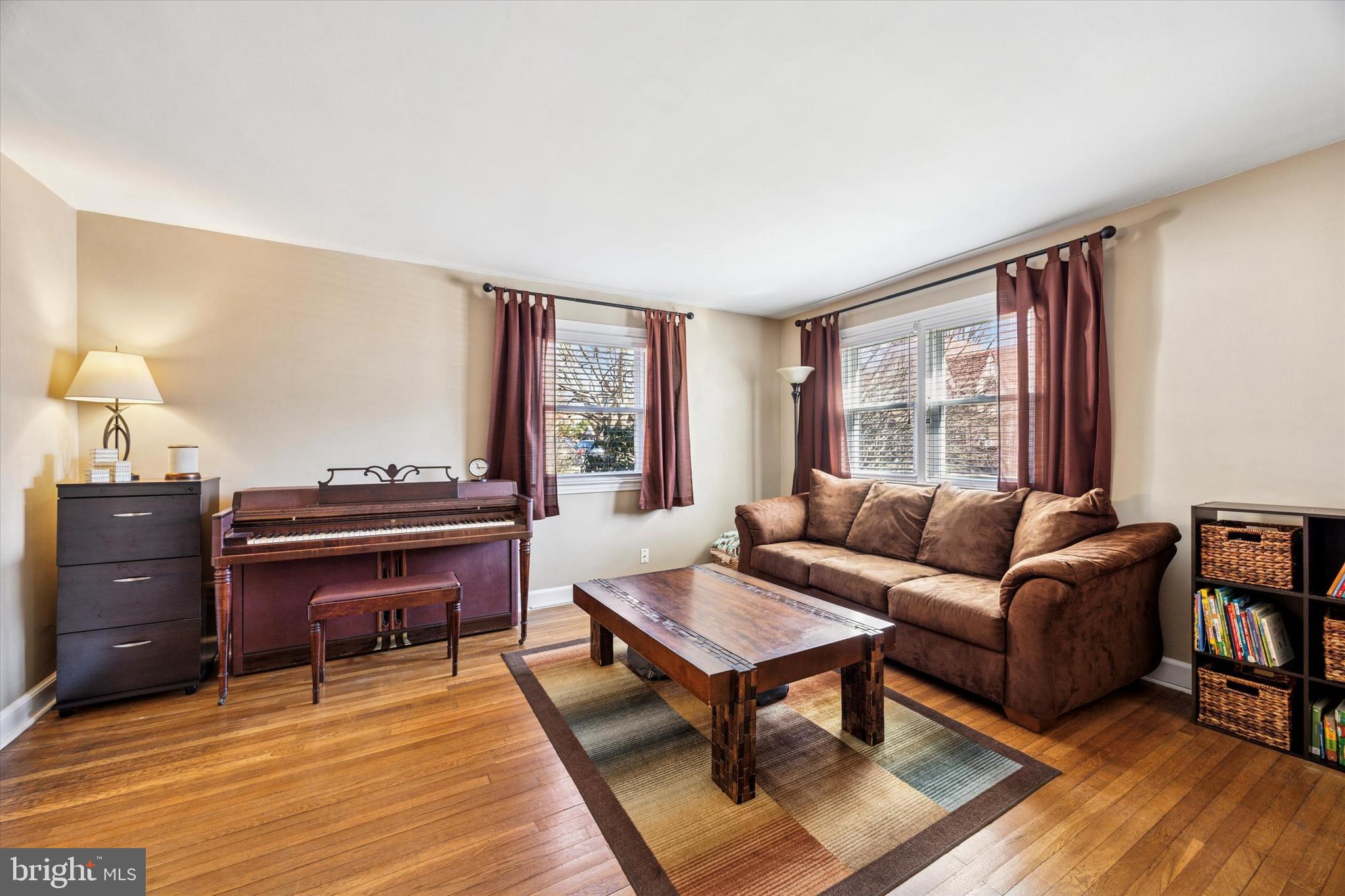 22 Mansfield Road Lansdowne, PA 19050 - Photo 4 of 25 a living room with furniture a piano and a window