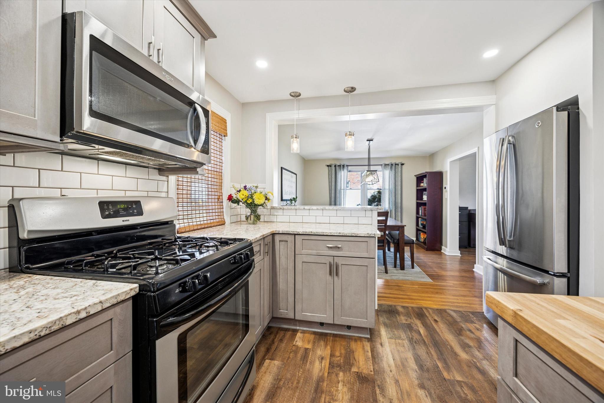 22 Mansfield Road Lansdowne, PA 19050 - Photo 10 of 25 a kitchen with stainless steel appliances granite countertop a stove refrigerator and microwave