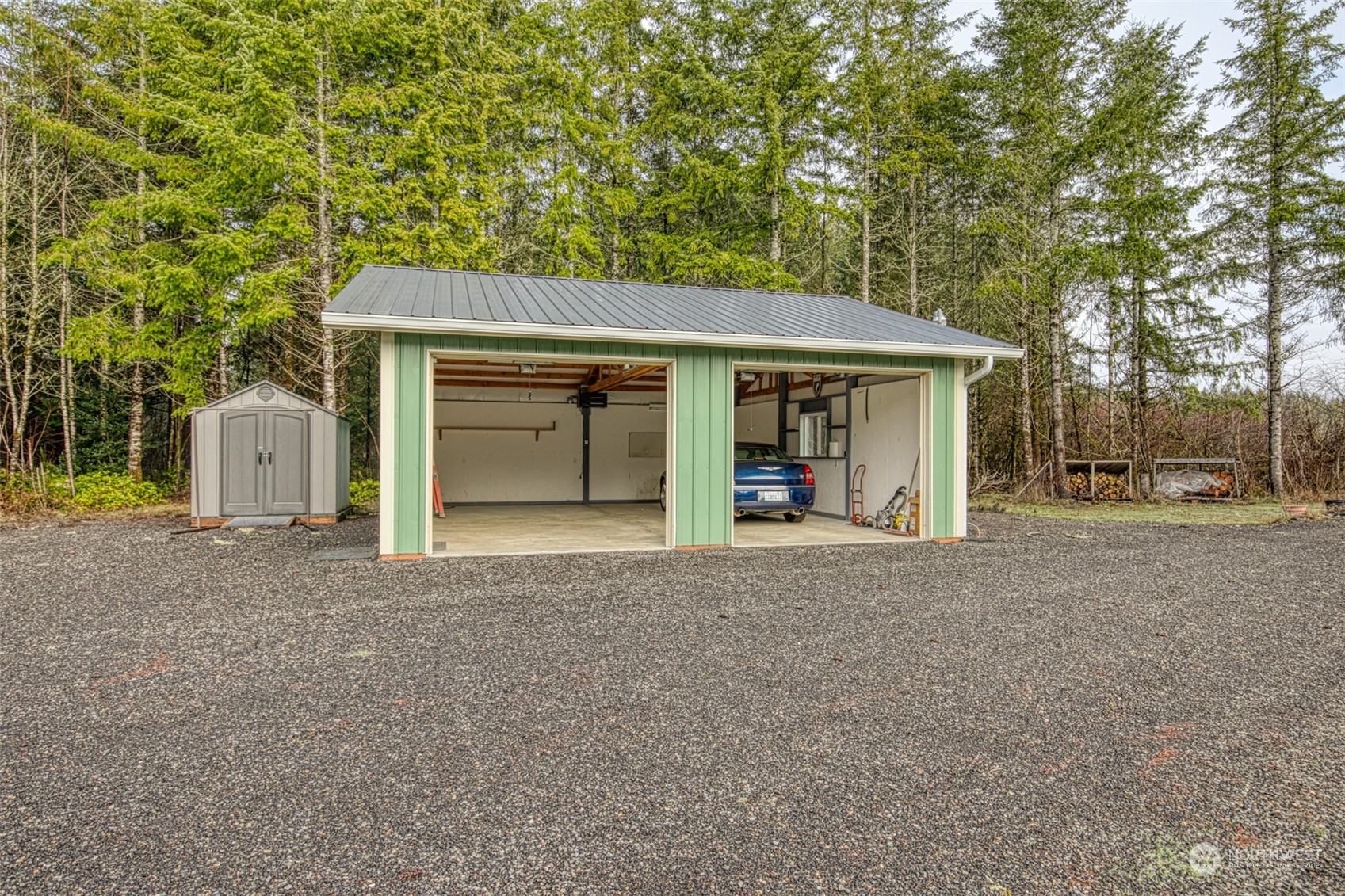 123 South Union Road Elma, WA 98541 - Photo 19 of 30 a view of a house with a yard and garage