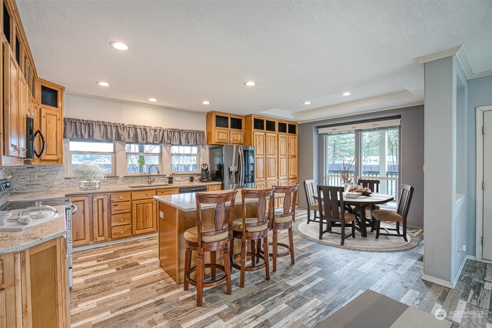 123 South Union Road Elma, WA 98541 - Photo 6 of 30 a kitchen with stainless steel appliances granite countertop sink stove and wooden cabinets