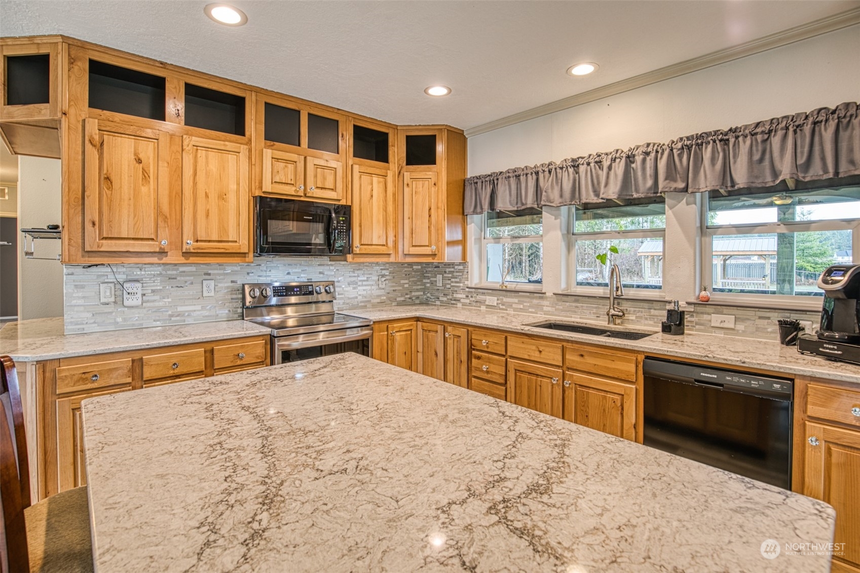 123 South Union Road Elma, WA 98541 - Photo 7 of 30 a kitchen with stainless steel appliances granite countertop a stove sink and cabinets