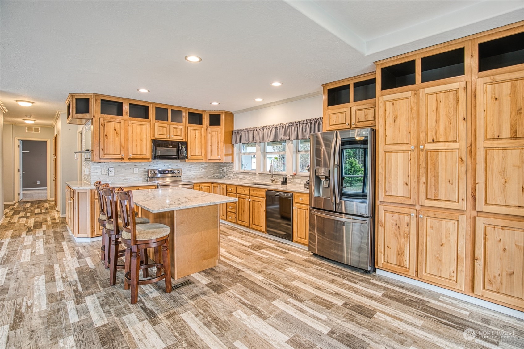 123 South Union Road Elma, WA 98541 - Photo 9 of 30 a kitchen with stainless steel appliances granite countertop a stove a sink and a refrigerator