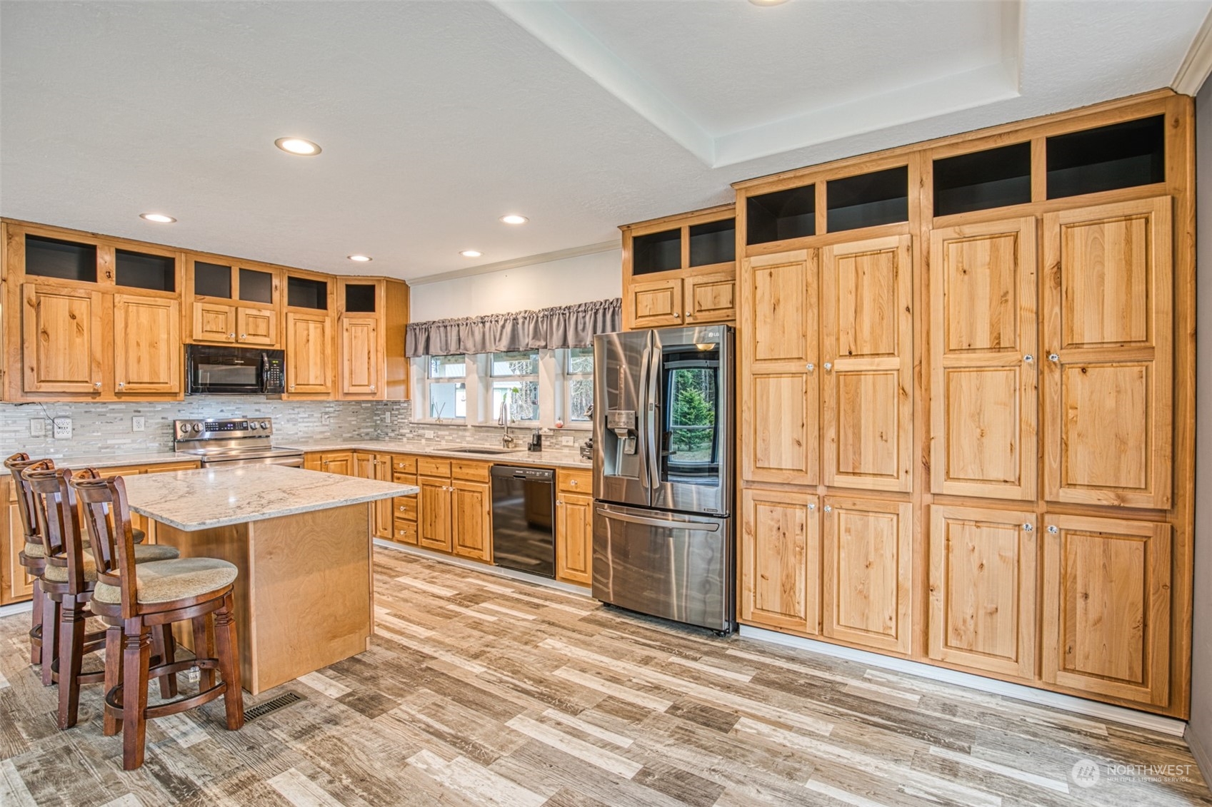123 South Union Road Elma, WA 98541 - Photo 10 of 30 a kitchen with stainless steel appliances granite countertop a refrigerator and a stove top oven