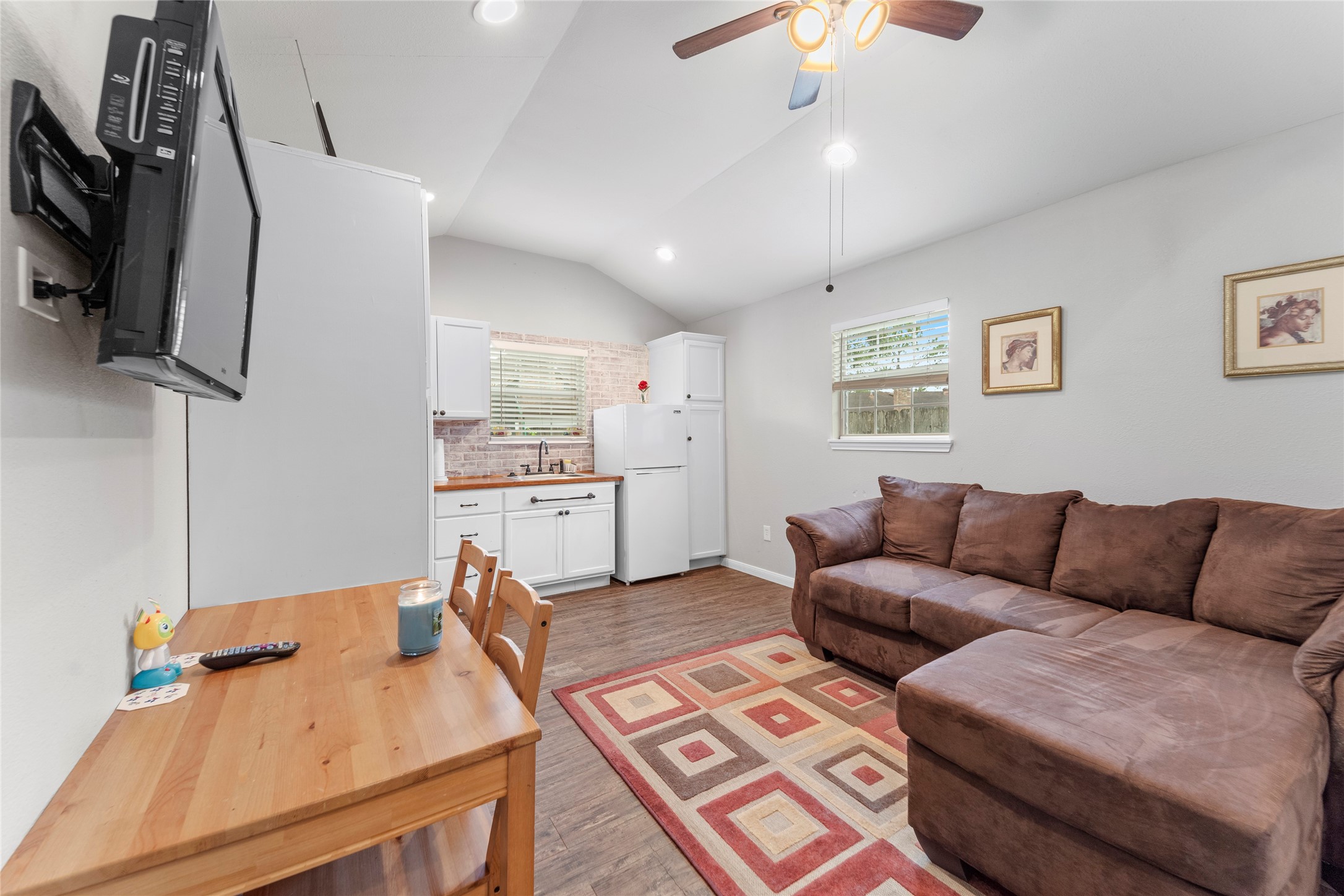 6951 Leandra Drive Houston, TX 77083 - Photo 1 of 12 a living room with furniture and a flat screen tv