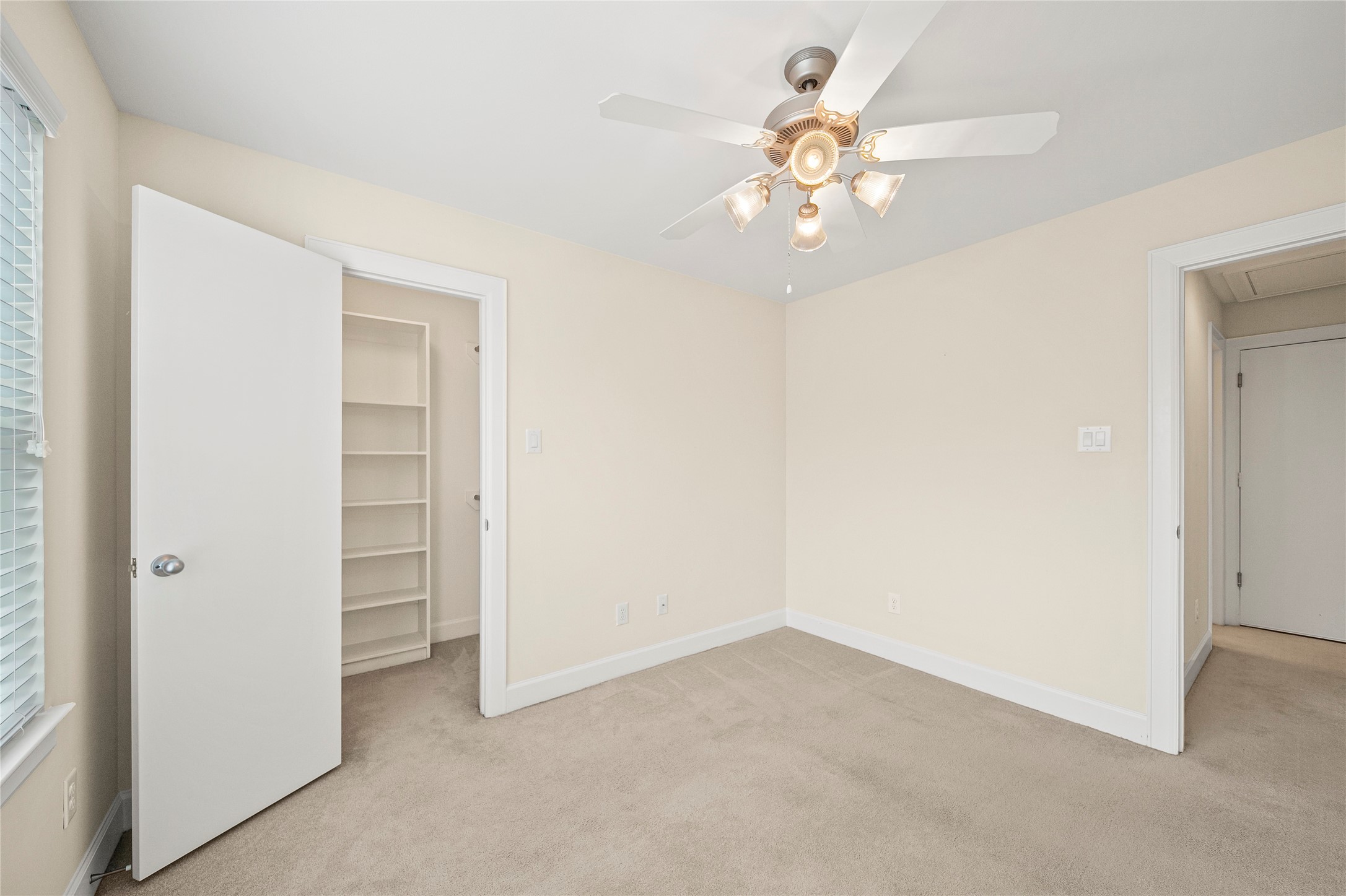 3726 Main Poplar Drive Houston, TX 77025 - Photo 18 of 25 wooden floor in an empty room with a ceiling fan